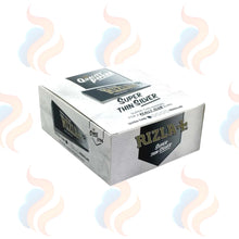Box of Rizla Super Thin Silver rolling papers with smoke graphics on a white background