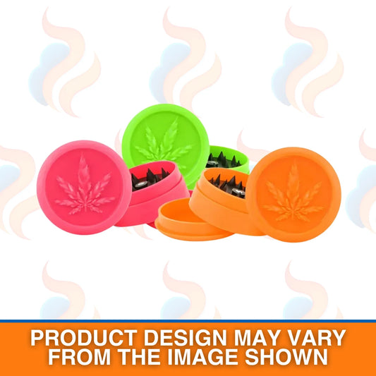Colourful Soft Touch cannabis-themed plastic grinder with leaves on a white background