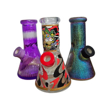 Three colorful glass smoking accessories on a white background