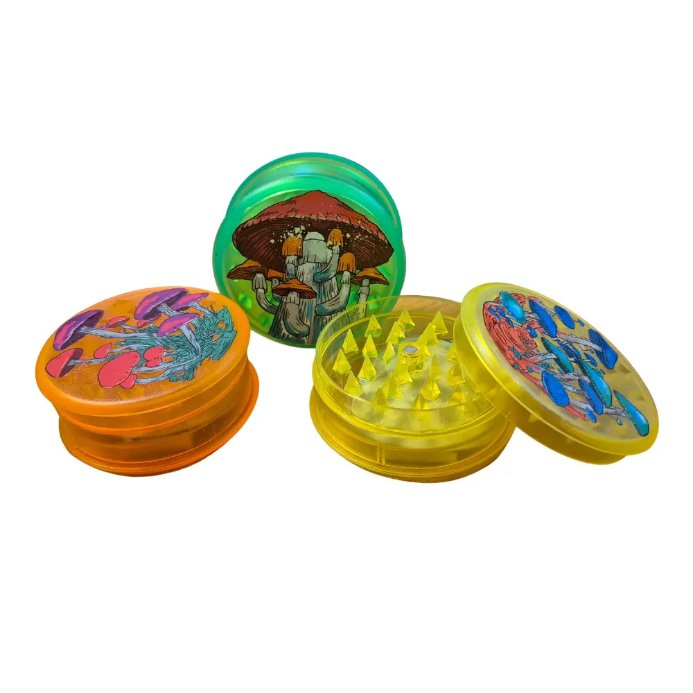 Three colourful Magic Leaf "Print-Collection" plastic grinders with mushroom inspired designs.