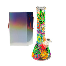 Colourful glass bong with floral and leaf designs next to a gradient gift box on a white background
