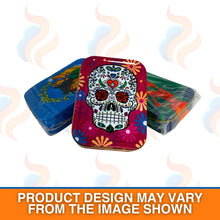 Three colourful storage baccy tins with a skull design on the front on a white background.