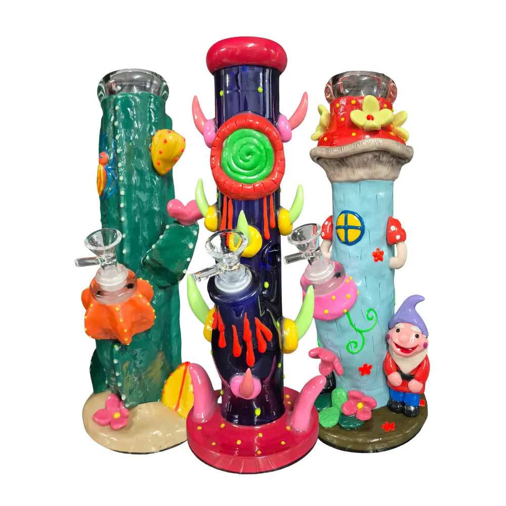 Three colourful cartoon-themed glass waterpipes on a white background