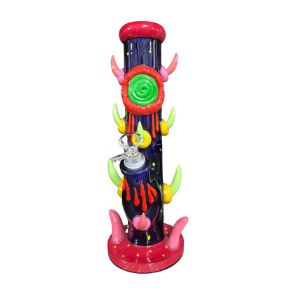 Colourful novelty glass waterpipe with an devil-inspired design on a white background