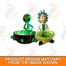 Two figurines, one green alien and one with blue hair, sitting around a smoking bowl with smoke effects.