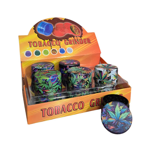 Display box of plastic Tobacco Grinders with a bold leaf design and colourful branding on a white background